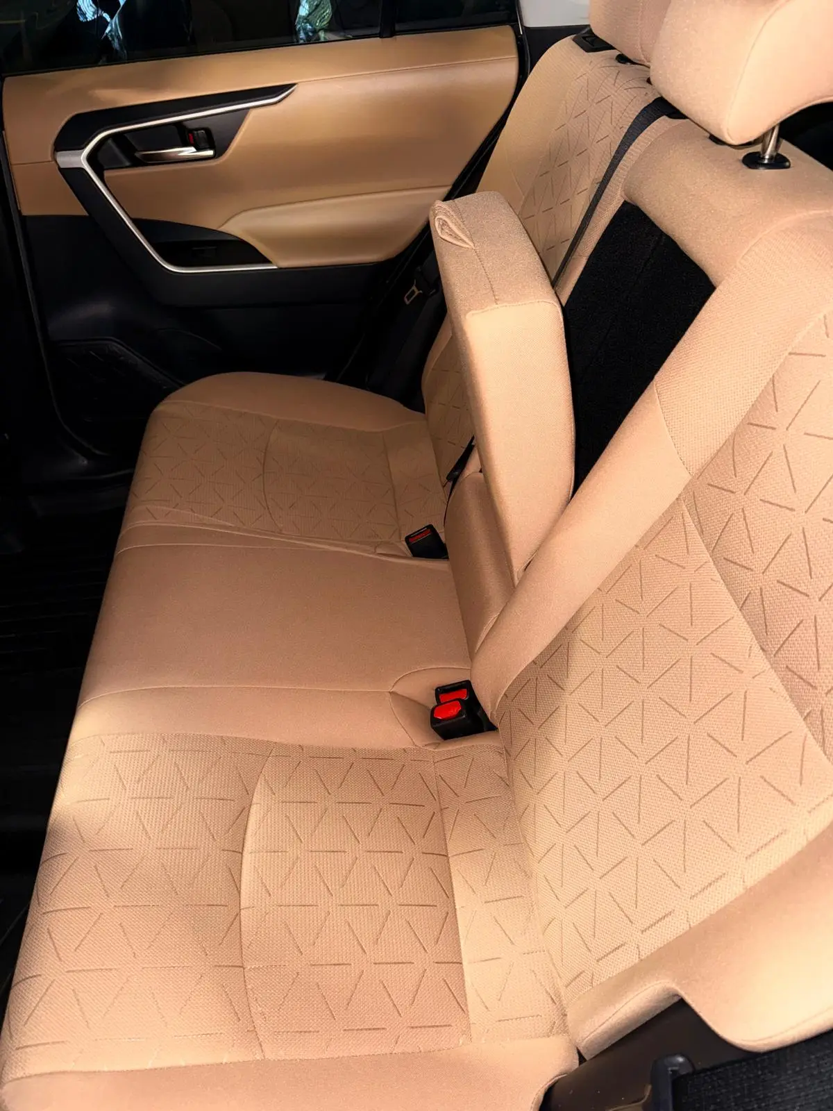 Before and after seat shampooing on SUV front seat in Fort Lauderdale — stains extracted by Route95 Mobile Car Detailing