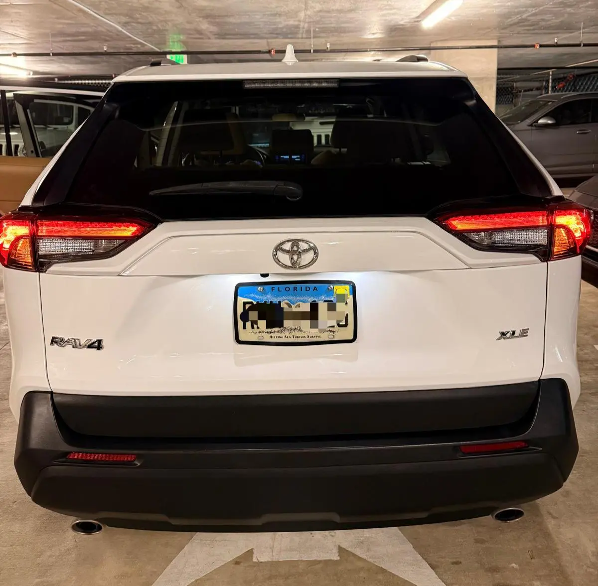 Before and after trim restoration on Toyota RAV4 rear bumper in Fort Lauderdale — faded trim restored by Route95 Mobile Car Detailing
